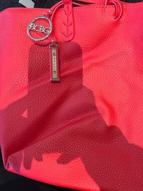 BCBG Paris Bright Coral Pebbled Tote with Gold Charm